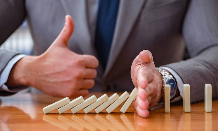 Businessman with dominoes in the office